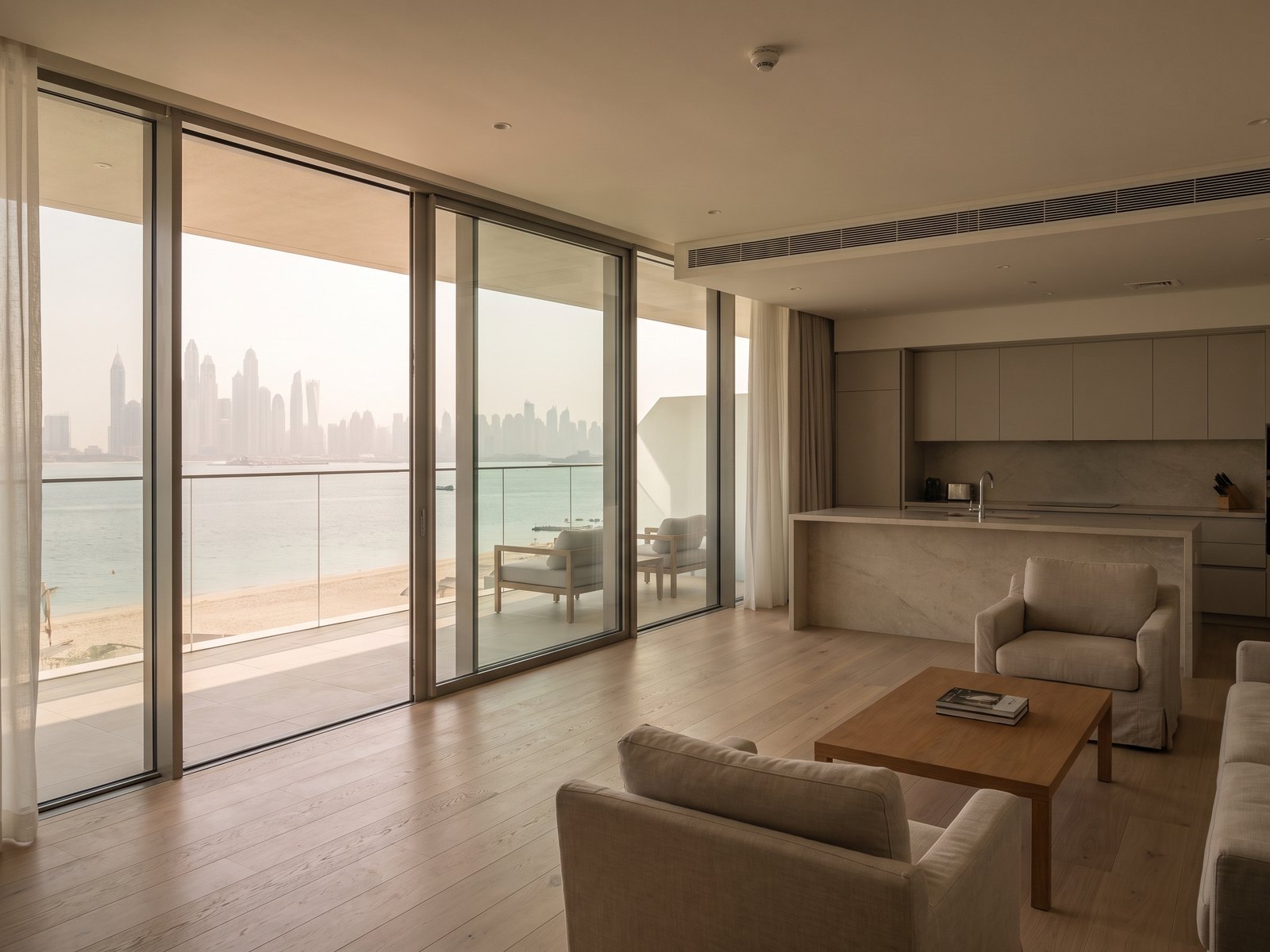Impression of an apartment at Bayshore at Creek Beach: a two-bed living room opening to a terrace over the beach